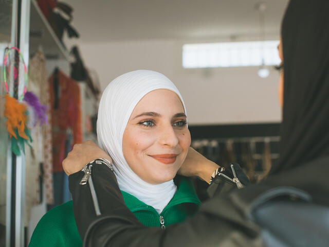 Nour is seen styling her customer and friend, Carine Trawy.